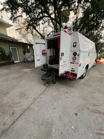 Magnet Plumbing service vehicle on-site for Grease Trap Cleaning in Country Club Estates